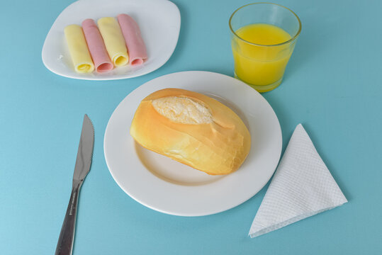 Brazilian bread pao frances on a minimalist table setting