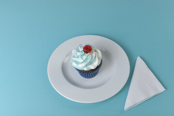 Cupcake on a minimalist table setting