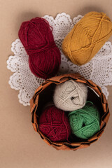 red, green and red wool yarn balls 