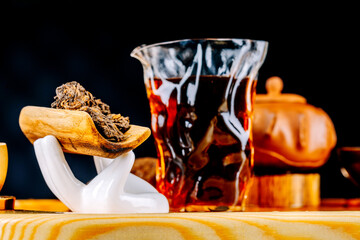 Chinese Pu-erh tea on a wooden stand. Tea ceremony