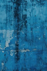 Obraz premium Textured blue grunge wall background for creative design projects. Vertical banner. Copy space. Saddest, depressing day. Seasonal depression, mental health concept. Blue Monday