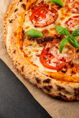 Pizza tomato margarita fast food natural product tasty snack fresh delicious gourmet food background on the table rustic top view copy space