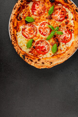 Pizza tomato margarita fast food natural product tasty snack fresh delicious gourmet food background on the table rustic top view copy space