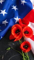 American flag and poppy bouquet on dark surface. Patriotic display of red, white, and blue
