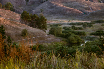 Winding Stream In Valley With Dry Grass Hills