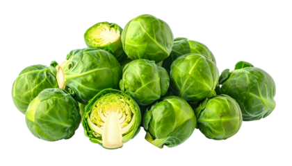 A pile of fresh, green mini cabbages, one bisected to reveal its inner structure