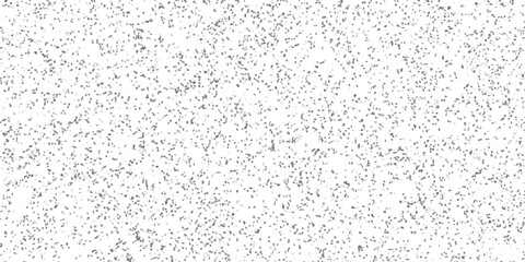 Obraz premium Abstract Grey Speckled Background with a Dense Distribution of Tiny Irregular Mosaic Dots on a Clean White Surface for Design Applications