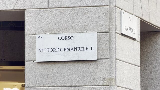 Corso Vittorio Emanuele II street sign mounted on a building corner in Milan, Italy.
