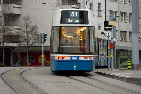 New tram number 51 passing at tram station Bahnhof Oerlikon East on a foggy autumn day at Swiss city of Z&uuml;rich. Photo taken December 14th, 2025, Zurich Oerlikon, Switzerland.
