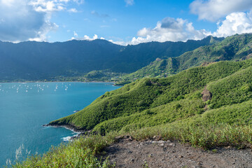 Taiohae Bay and town with anchored sailboats in Nuku Hiva, Marquesas Islands, French Polynesia