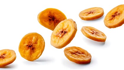 Isolated dried banana slices falling against a white background