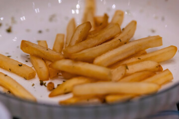 Macro Close-up of French Fries Texture with Herb Seasoning