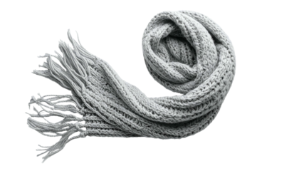 Close-up of a cozy, gray knit scarf, with thick weave and long tassels