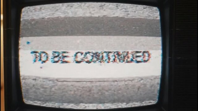 Retro TV screen. Distorted 'To be continued' text. Vintage television with static noise. Old CRT display. Glitchy broadcast signal. Screen flicker. Distorted image. TV static.