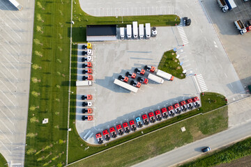 Parking of new and used trucks near the distribution and service center. Aerial view