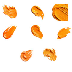 Orange paint brush strokes set abstract cosmetic swatch isolated on white background