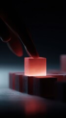 Close-up of a hand placing the final glowing block on a structured foundation made of solid cubes, symbolizing project completion, finalization, and building success on a strong base.