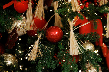 Elegant Christmas Tree Decorated with Red Berries and Ornaments