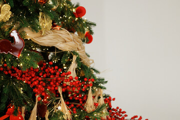 Elegant Christmas Tree Decorated with Red Berries and Ornaments