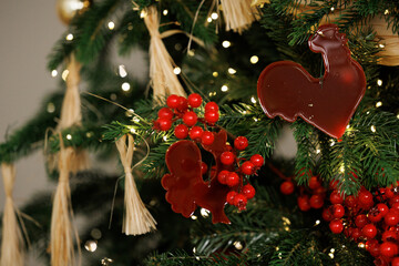 Elegant Christmas Tree Decorated with Red Berries and Ornaments