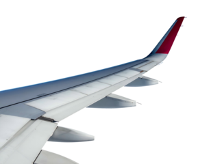 Aircraft wing with red wingtip against black sky