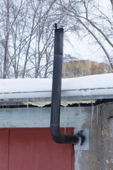 Iron stove pipe. Heating the room with firewood.