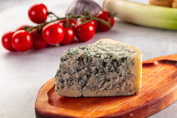 Blue cheese piece over board