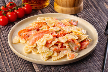 Italian pasta farfalle with salmon