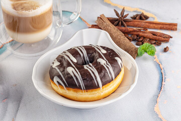 Delicous sweet donut with chocolate glaze