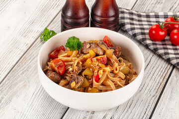 Asian udon noodles with beef