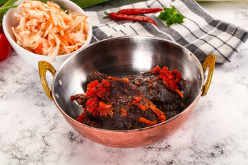 Baked beef cheeks with vegetables