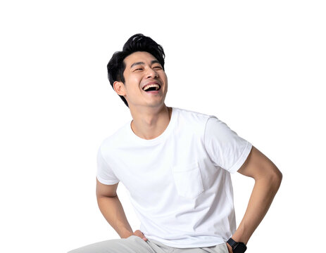 Young man laughs heartily, looking up