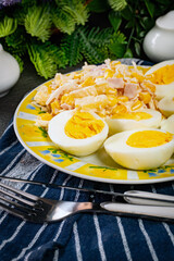 Breakfast. Hard-boiled eggs with ham, pineapple and corn salad.