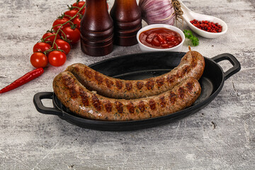 Grilled beef sausages with sauce