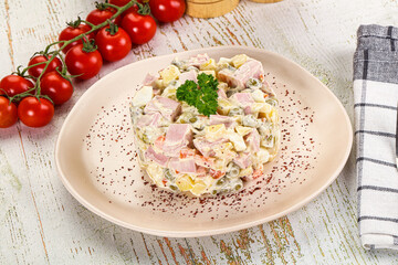 Russian traditional Olivier salad with sausages