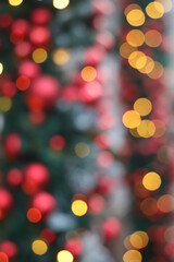 Abstract  holiday with festive gold bokeh light on Christmas tree blurred background christmas tree with bokeh lights red green gold golden ornament creating festive holiday backdrop Merry christmas