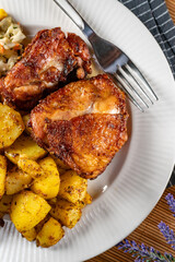 Appetizing baked chicken leg quarter.