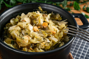 Stewed cabbage with onion and greaves.