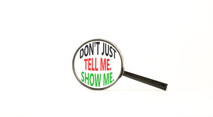 Tell or show symbol. Concept words Do not just tell me, show me on beautiful magnifying glass. Beautiful white background. Business tell or show concept. Copy space.