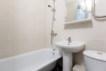 modern bathroom room with toilet and washing machine