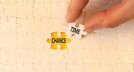 Chance time symbol. Concept word Chance time on beautiful white puzzles. Businessman's hand. Beautiful yellow paper background. Business chance time concept. Copy space.