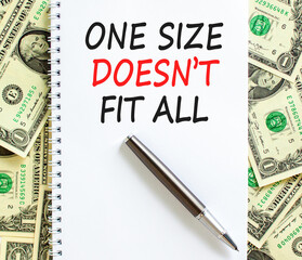 One size does not fit all symbol. Concept words One size does not fit all on beautiful white note. Beautiful dollar bills background. Business one size does not fit all concept. Copy space.