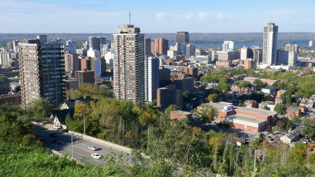 Skyline of Hamilton, Ontario, Canada on a sunny autumn afternoon. Arkledun Avenue in the foreground.