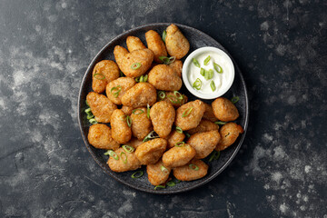 Crispy Jalapeno cheese bites with sauce. Party food snacks