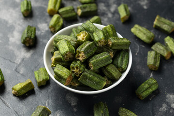 Crispy okra chips in a white bowl. Healthy snack