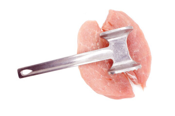 Metal meat hummer and two Pork Chops isolated on white background. Cooking Pork meat. Piece of pork loin for chipping. Close-up. 