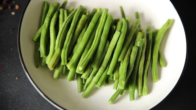 Green beans raw fresh vegetable string bean healthy food ingredient appetizer fresh tasty gourmet food background on the table rustic top view copy space keto and paleo diet vegetarian and vegan food