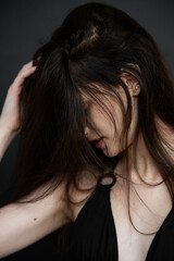 Obraz premium Young beautiful fashion model woman posing in studio, natural beauty, clean skin, professional modeling portfolio, elegant female portrait, modern style, confident look, people concept photography