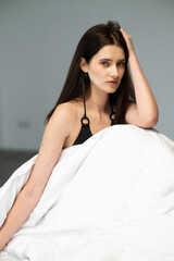 Natural emotional portrait of young woman model with expressive face, authentic beauty, lifestyle mood, clean skin, real emotions, modern female portrait photography in studio