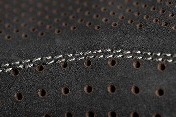 Naklejka premium smooth perforated leather for shoe production , a large number of equal holes in natural leather for shoe production
